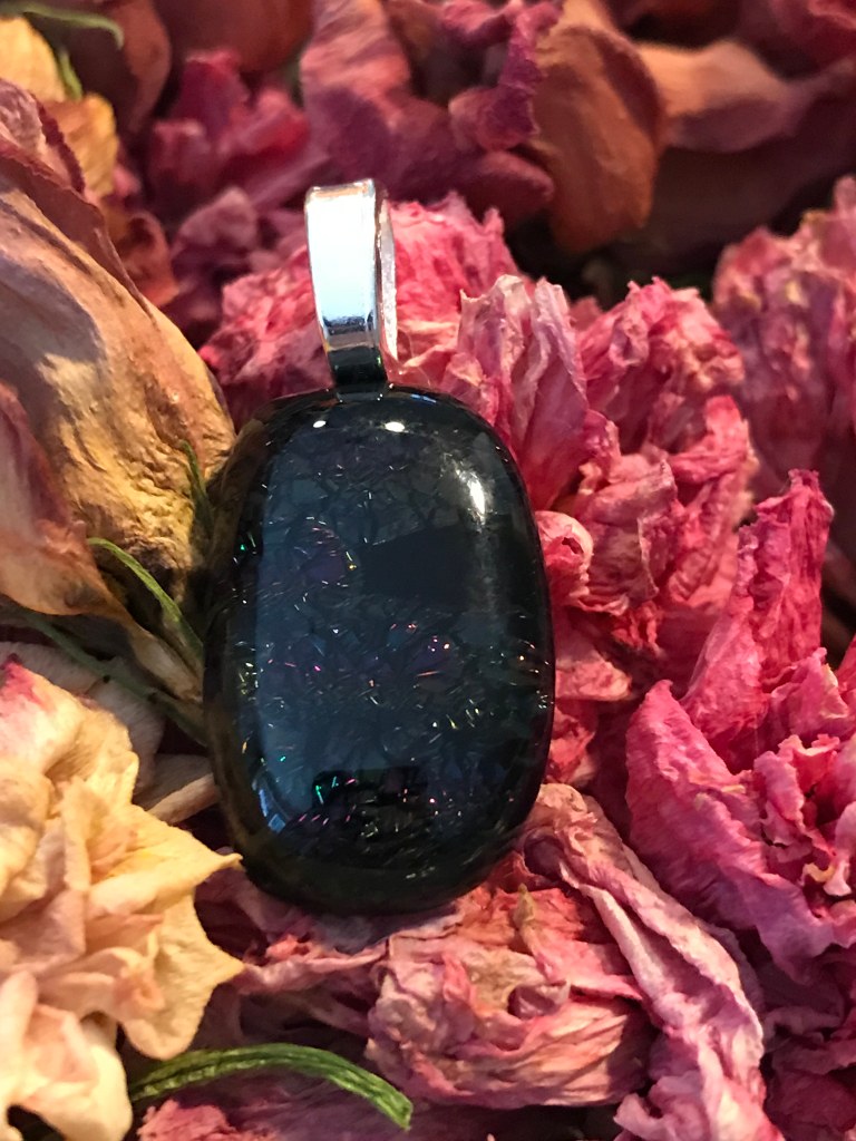 Black glass pendant with dichroic rainbow sparkle
